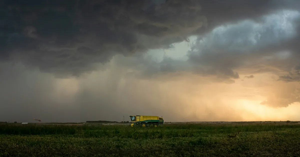 combine in field during storm