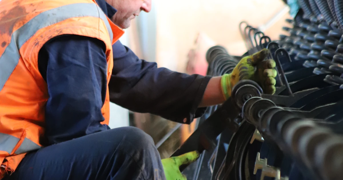 man inspecting air drill row