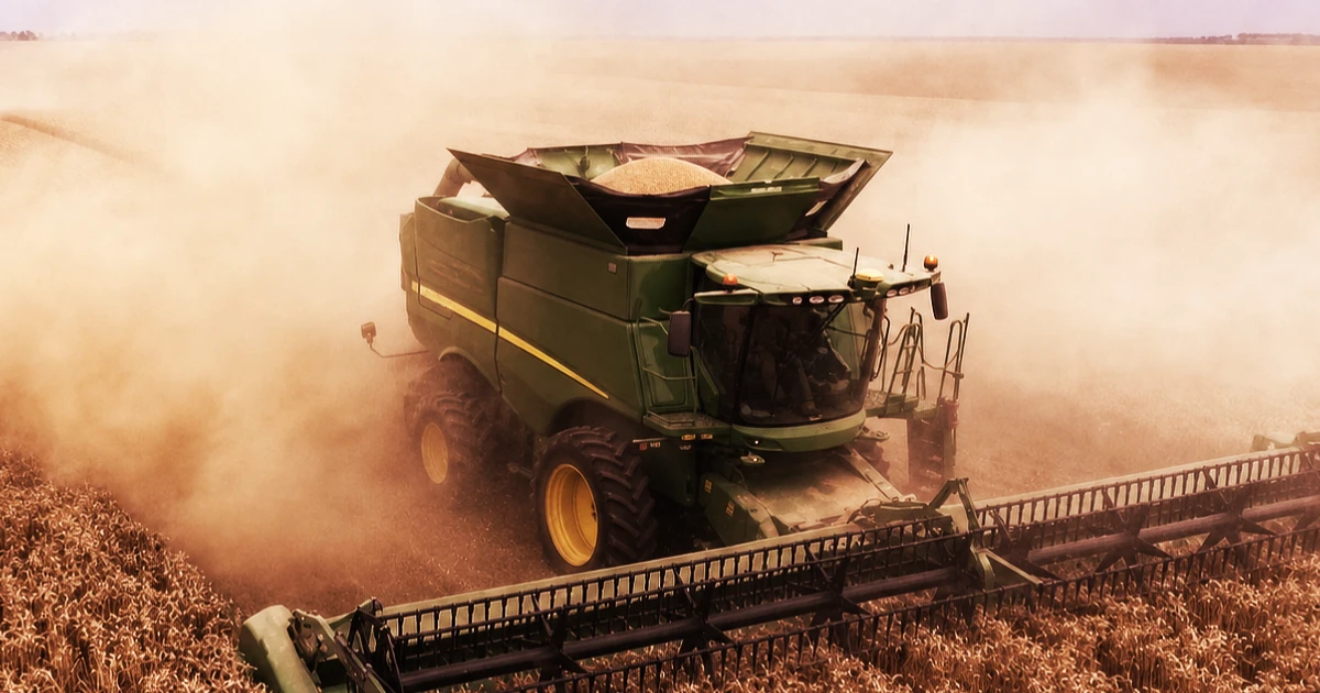 combine working in dusty field