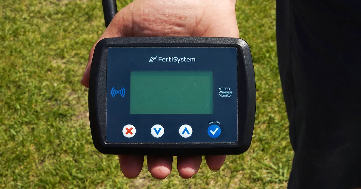 Fertisystem AT200 display being held in palm of hand
