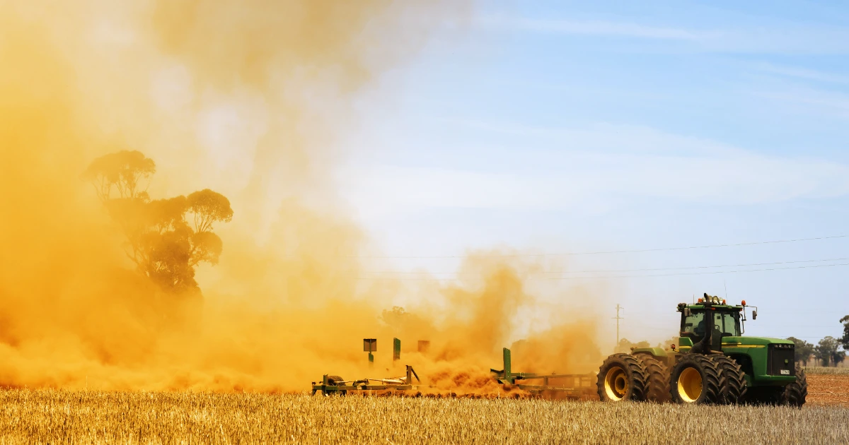 tractor in dusty field