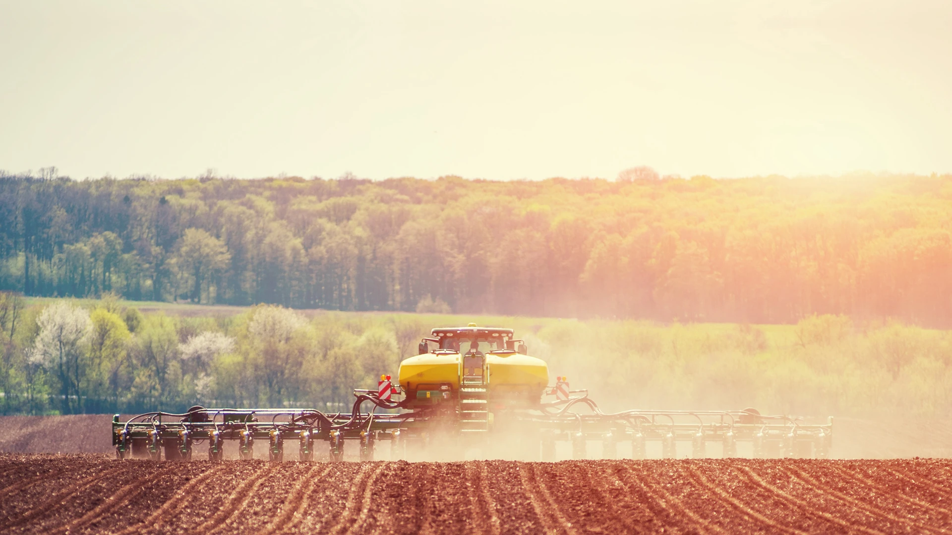 planter with air seeder driving down field