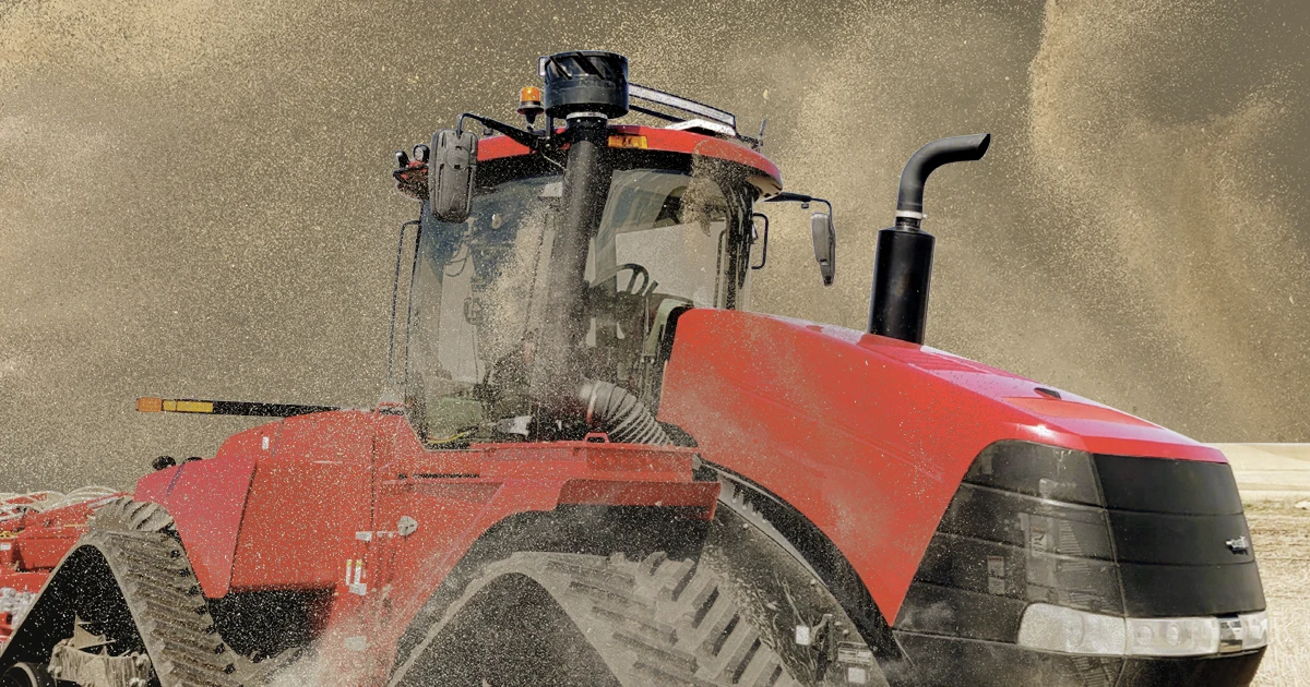 tractor in dust storm but equipped with KAS pre-cleaner