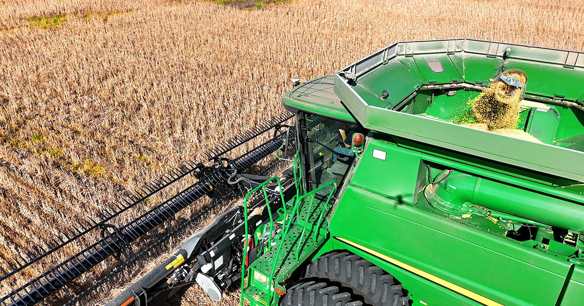 John Deere combine harvesting field