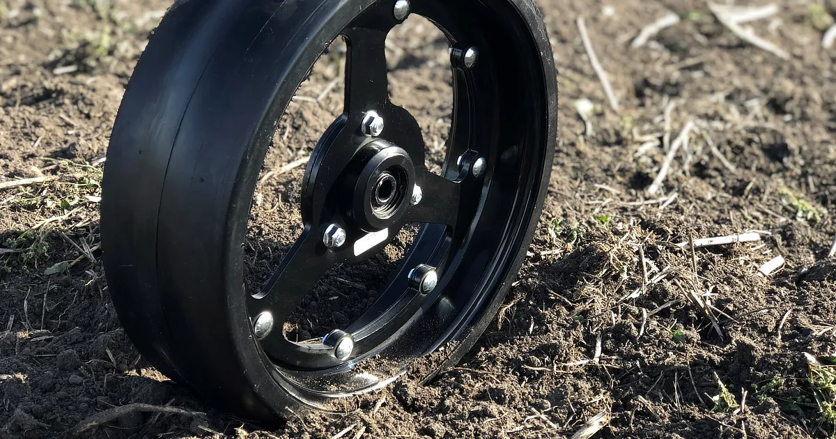 MudSmith spoked gauge wheel sitting in mud
